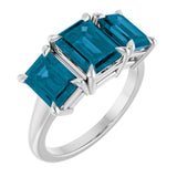 Platinum 8x6 mm Emerald Natural London Blue Topaz Three-Stone Ring